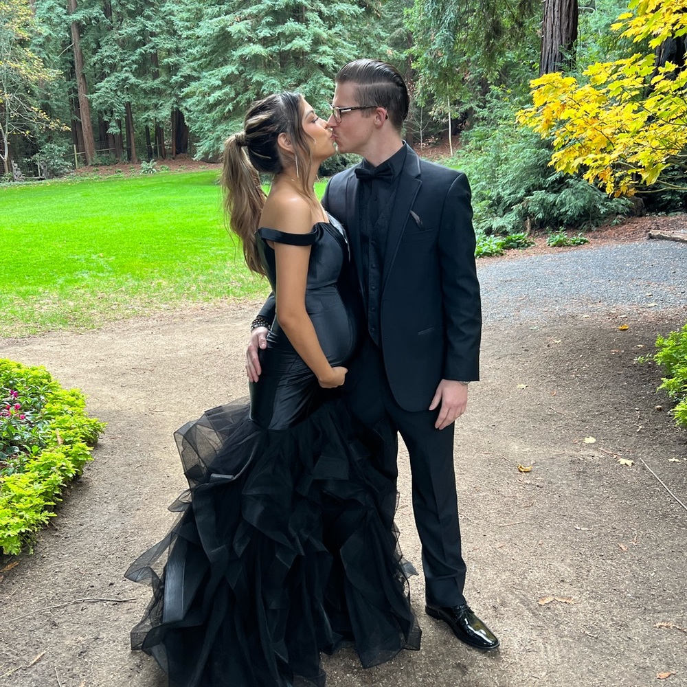 Black gown, ruffle bottle.